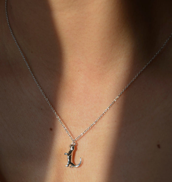 Looking chic in everyday jewellery sculptural baby komodo dragon necklace crafted in recvcled silver.